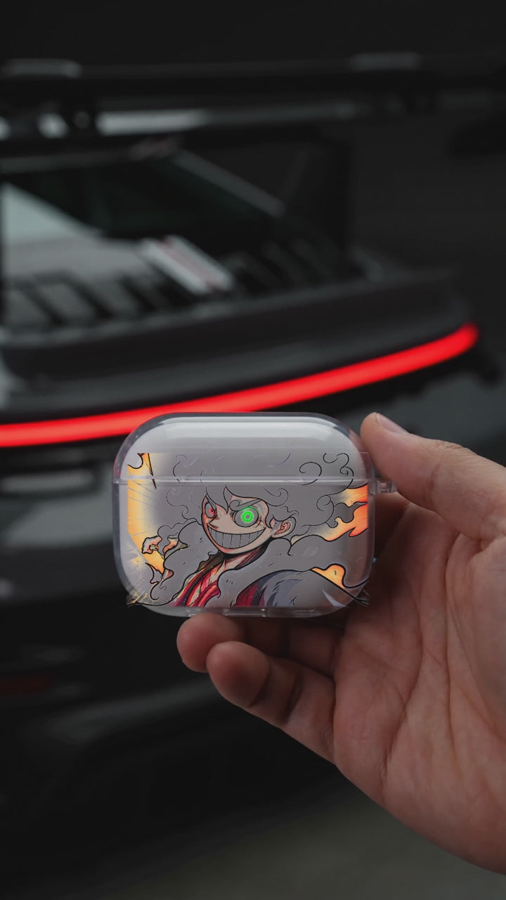 Gear Five AirPods case opening in hand with Porsche background