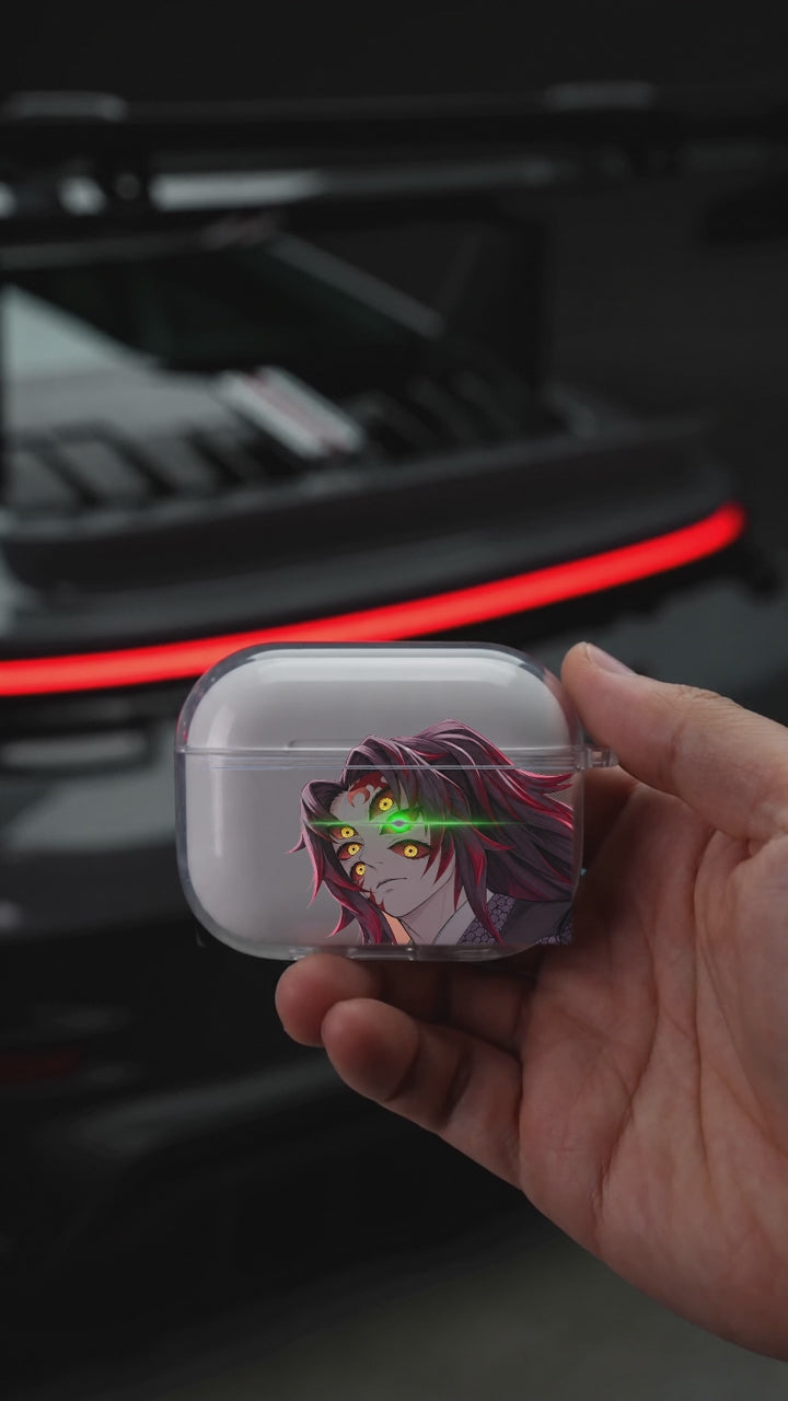 Kokushibo Eyes AirPods case opening in hand with Porsche background