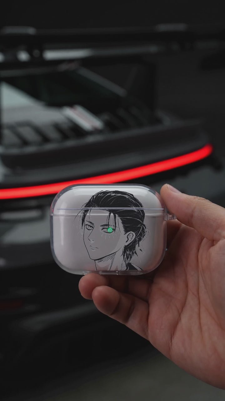 Eren Portrait AirPods case opening in hand with Porsche background