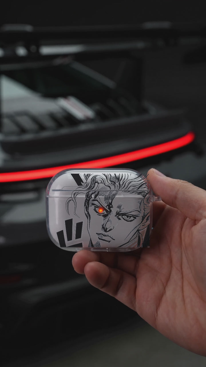 Golden Wind AirPods case opening in hand with Porsche background